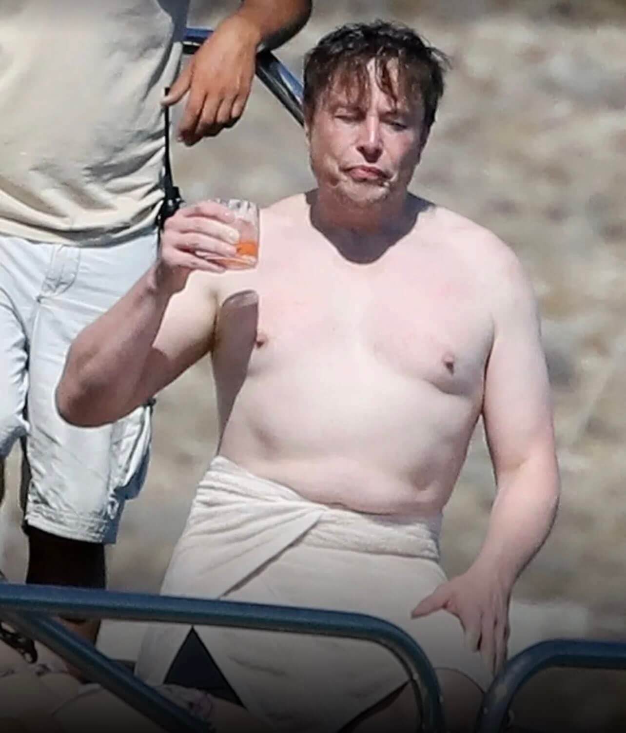 Elon Musk responds "Maybe I should take my shirt off more often"