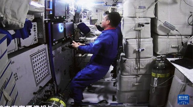 Thienchow-6 cargo spacecraft docked with space station assembly