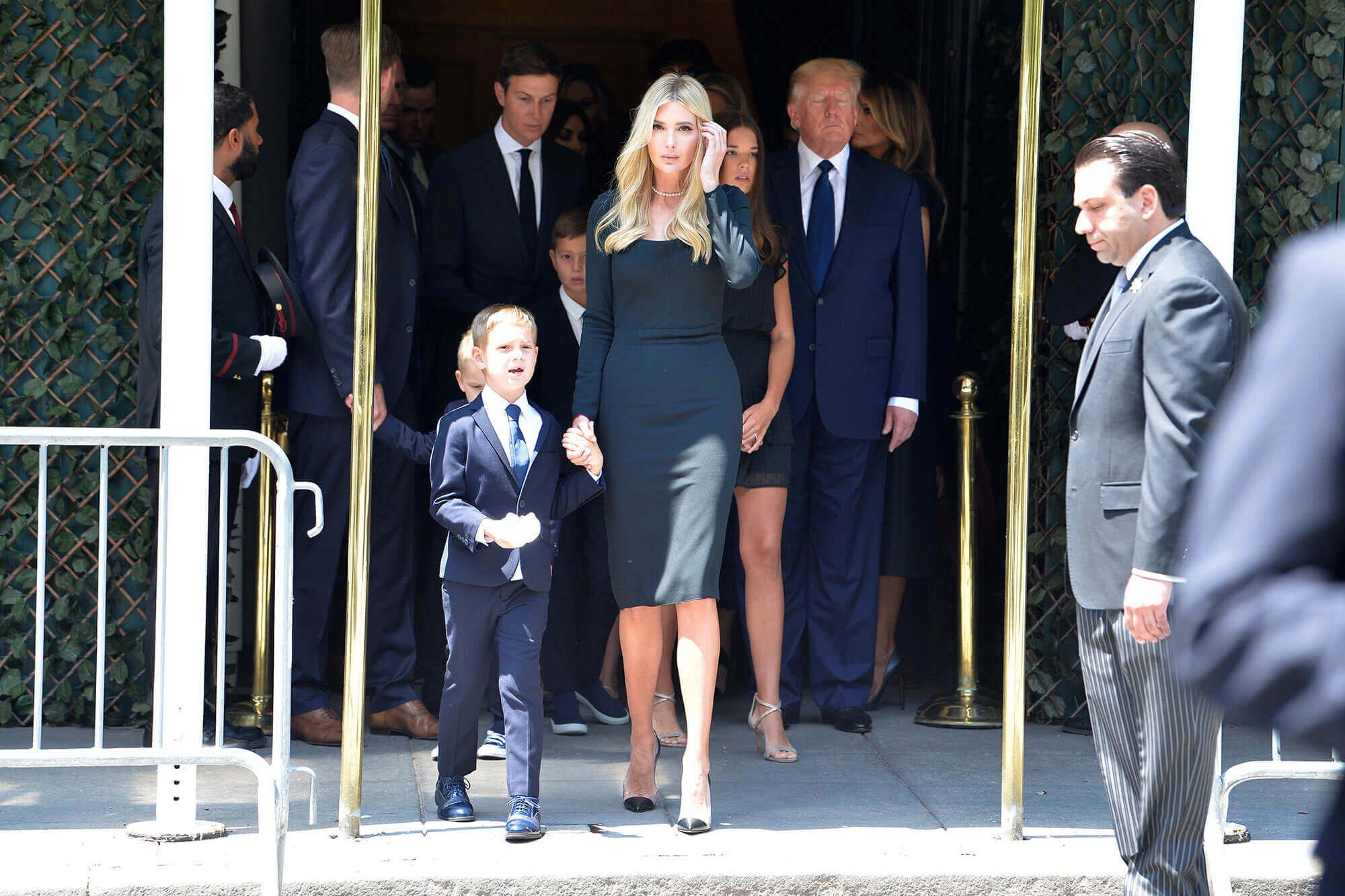 Members of the Trump family prepare to depart for St. Vincent Ferrer Catholic Church.